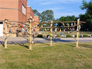 Bird display in front of school.